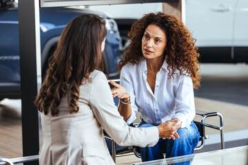 Naklejka premium Two Women Having a Serious Conversation at a Car Dealership Showroom