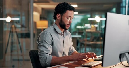 Man, computer and typing at startup, office and glasses for project management at media company. Person, writer and pc with insight, review proposal or editing process for article at creative agency