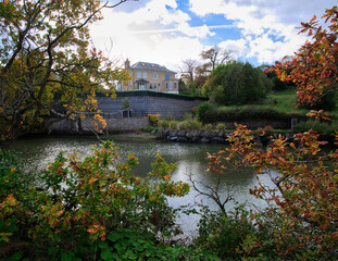 Obraz premium big stone house on the river bank