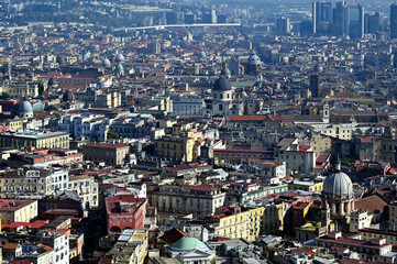 Aerial view of Naples, Italy. rooftops of residential houses and churches. dense cityscape, built environment. travel and tourism. panoramic view from the hill above the city. colorful skyline. 