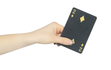 playing card diamonds 2 in hand, outstretched hand with black playing card isolated from background