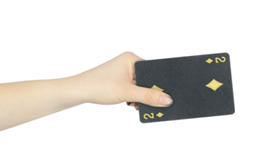 playing card diamonds 2 in hand, outstretched hand with black playing card isolated from background