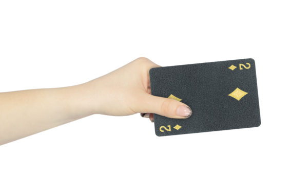 playing card diamonds 2 in hand, outstretched hand with black playing card isolated from background