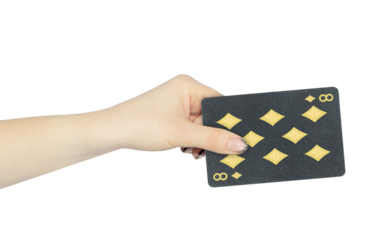 playing card diamonds 8 in hand, outstretched hand with black playing card isolated from background