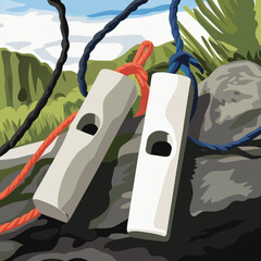 Two whistles and ropes on a rocky mountain landscape