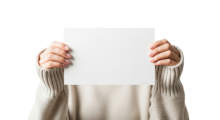 Woman holding blank white cardboard in cozy knitted sweater against black background