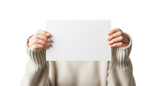 Woman holding blank white cardboard in cozy knitted sweater against black background