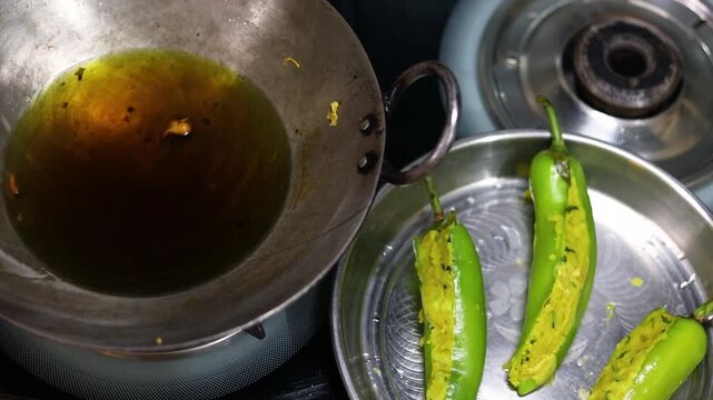 Mirchi vada or mirchi pakoda deep fried chili filled with spicy potato