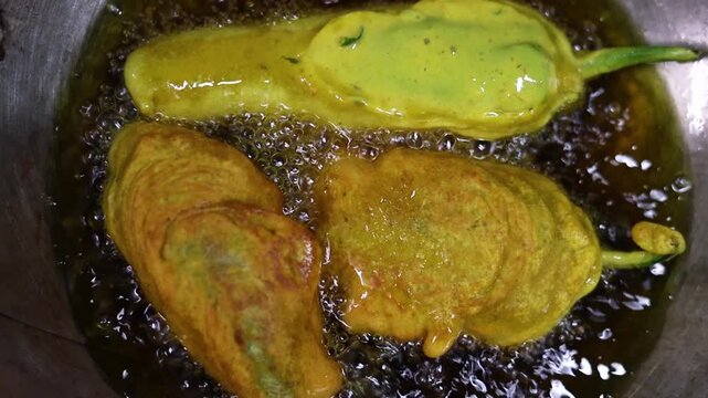Mirchi vada or mirchi pakoda deep fried chili filled with spicy potato