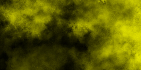 Yellow color powder explosion cloud isolated on black background.  dust smoke . Yellow dust particles explosion background .