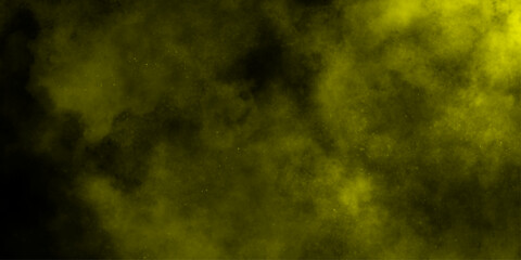 Yellow color powder explosion cloud isolated on black background.  dust smoke . Yellow dust particles explosion background .