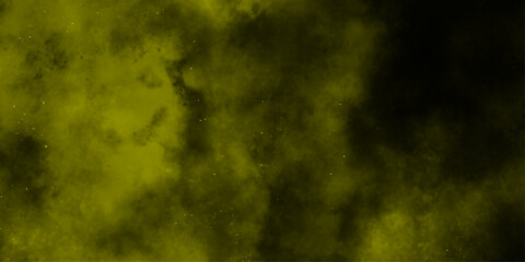Yellow color powder explosion cloud isolated on black background.  dust smoke . Yellow dust particles explosion background .