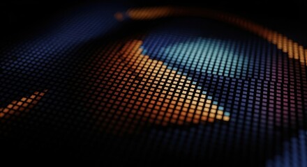 Closeup abstract background of illuminated digital screen pixels with orange and blue light in dark setting