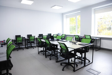 Computer science class with laptops at school