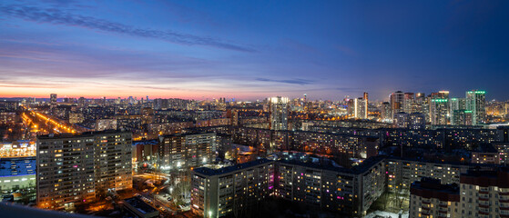 Dawn clouds over the metropolis of early sunset