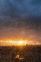 drops on the glass after rain and rainbow