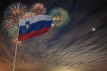 Waving National flag of Slovenia and holiday fireworks