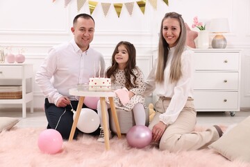 Birthday celebration. Portrait of happy family with tasty cake at home