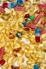 Macro close up of a lot of pain pills and supplements