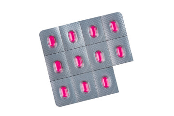 Isolated blister pack of bright pink pills