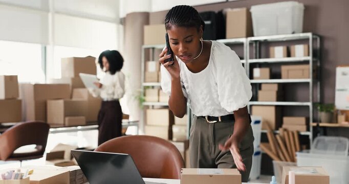 Laptop, woman or frustrated with phone call in shipping for supplier delay, delivery mistake or crisis. Distribution staff, owner and stress with mobile contact for box label error or logistics fail