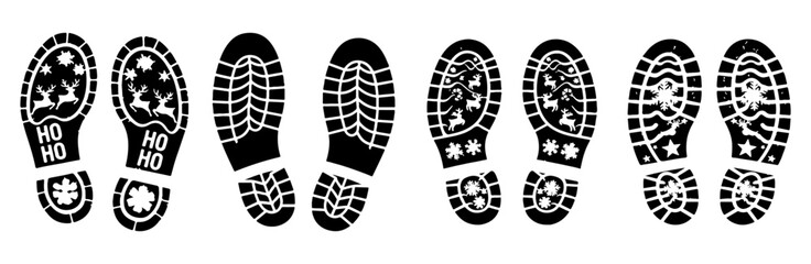 Footprints with christmas and winter themed designs in black and white on a white isolated background