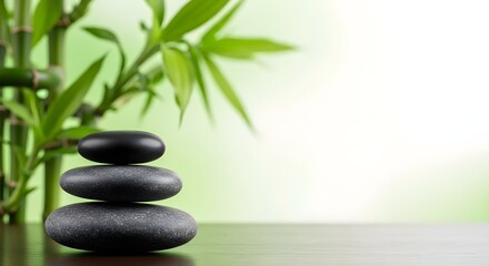 Zen stones stacked with bamboo for relaxation and wellness background