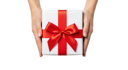 Hands holding a white gift box with a red ribbon bow, isolated on transparent background