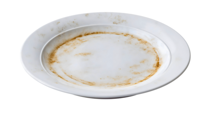 A filthy porcelain plate with dried food isolated on a plain background, a used dinner dish with brown stains, a greasy kitchen object for cleaning, a messy ceramic tableware after a meal.