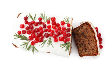 Tasty Christmas cake with icing, cranberries and rosemary isolated on white, top view