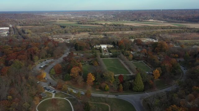 Aerial view of Ault Park with its symmetric gardens and surrounding colorful trees displaying autumn foliage, Cincinnati, Ohio, United States.