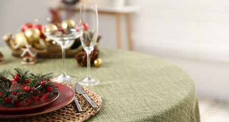 Festive table setting with Christmas decor indoors, closeup. Space for text