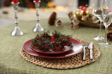 Festive table setting with Christmas decor indoors, closeup