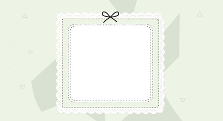 A decorative square frame with lace and a bow on a pastel green abstract background.