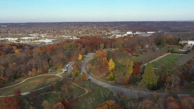 Aerial view of Ault Park's autumn colors, contrasting with the green lawn and the building on the hilltop, Cincinnati, Ohio, United States.