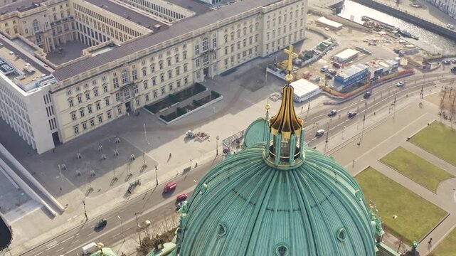 Aerial view of the gleaming green dome of the Berlin Palace, contrasting against the urban landscape and river Spree, Berlin, Berlin, Germany.