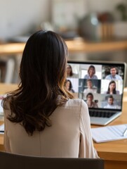 Naklejka premium back view of business latin woman talking to her mexican colleagues in video conference business team using laptop for a online meeting in video call working from home in latin america no logos no br