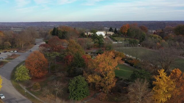 Aerial view of Ault Park, featuring the contrasting colors of autumn foliage surrounding the lush green lawns and building, Cincinnati, Ohio, United States.