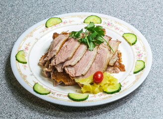 Savor the flavor of roasted duck, artfully plated with cucumbers and herbs. Ideal for culinary projects, food blogs, or restaurant promotions.