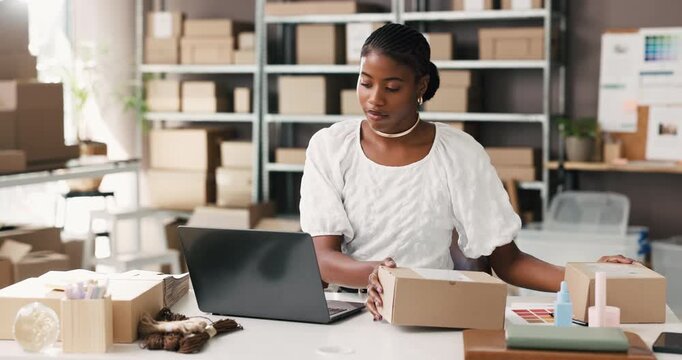 Supply chain, box and black woman on laptop for online orders, distribution and logistics. Small business, invoice and person on computer for shipping label, delivery info and inventory on website