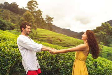 Couple of Travelers in Love in Front of Nature Background Tea Plantations