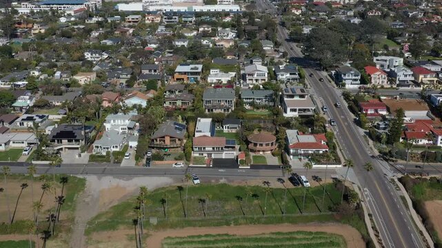 Aerial view of Yogananda Ashram with its serene white buildings and golden domes amidst lush greenery, a haven of tranquility, Encinitas, California, United States.