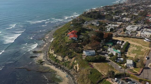 Aerial view of Yogananda Ashram, the cliffside retreat with red roofs contrasting against the blue ocean, Encinitas, California, United States.