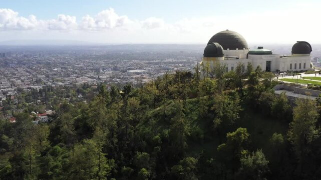 Aerial view of the Griffith Observatory, a beacon of science and culture, perched atop the Hollywood Hills, Los Angeles, California, United States.