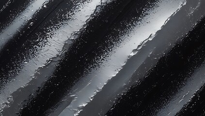 Abstract grayscale diagonal striped pattern grainy background featuring rough, gritty textures and sharp edges, creating a dynamic visual surface design.