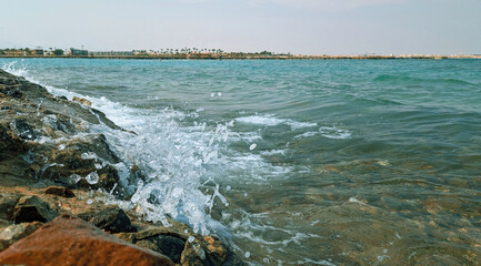 Seascape View with Splashing Waves on Rocky Shoreline, Serene Coastal Scene, Refreshing Vacation