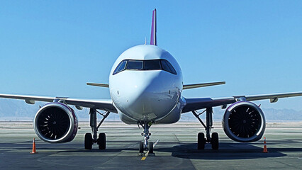 Naklejka premium Commercial Airplane on the Tarmac Ready for Takeoff, Front View. Aviation and Travel Theme.