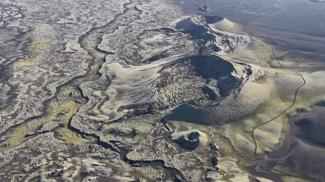 Aerial view of the stark landscape around the Laki volcano, with contrasting dark lava fields and lighter volcanic cones, Skaftarhreppur, Iceland.