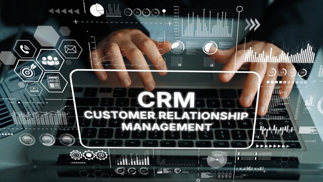 Hands Typing on Keyboard with Data Analysis Graphics and CRM Customer Relationship Management Text Overlay. Asymptotic smart data analytic.