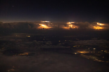 Powerful electrical storm viewed form an airplane before sunrise